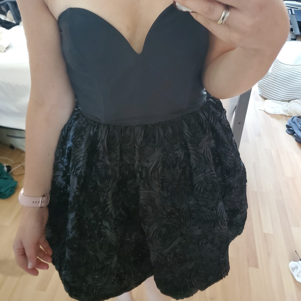 Black cocktail dress with deep sweetheart neckline